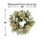 Couronne de pin 24 po avec magnolias, feuilles scintillantes, baies et pommes de pin Jhumki