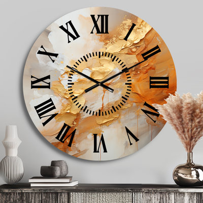 Horloge murale à spirales abstraites et or
