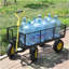 Les chariots de jardin BIG Wagon Cart facilitent le transport du bois de chauffage jaune et noir. La charge statique maximale est de 880 lb.