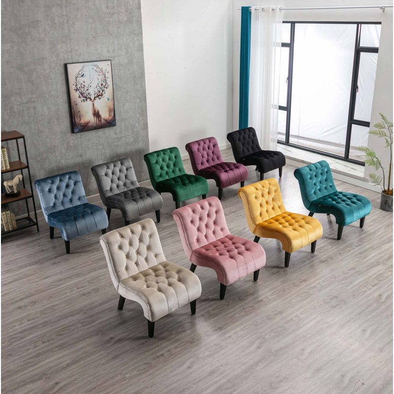 Fauteuil d'appoint sans accoudoirs en velours avec capitonnage et pieds en bois robustes