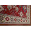 Tapis rouge à motif oriental Kazak