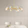 Lustre 8 lumières dorées avec abat-jour en verre transparent