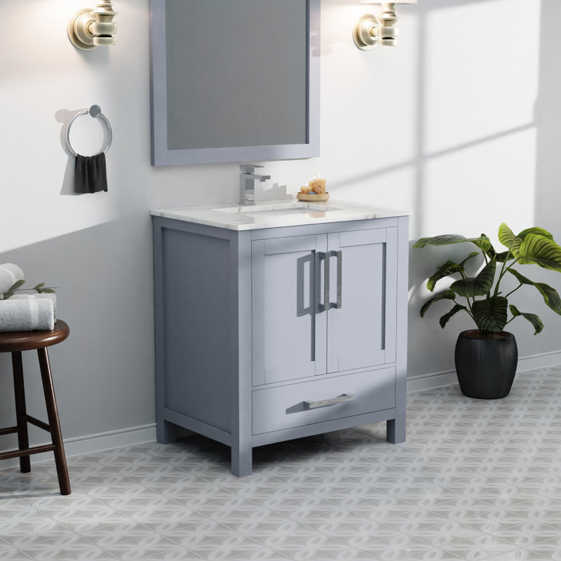 Meuble-lavabo gris foncé de 76 cm de largeur avec miroir de 71 cm, profondeur de 56 cm, un placard et un tiroir offrant beaucoup d'espace de rangement.