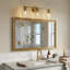 Applique à trois lumières pour meuble-lavabo à bras en verre transparent en laiton satiné