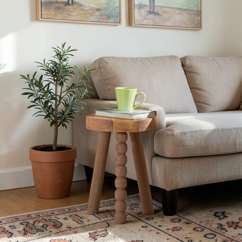 Tabouret décoratif polyvalent en bois d'acacia Gianni - table d'appoint artistique avec base arrondie à trois pieds