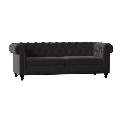 Canapé Chesterfield à accoudoirs roulés