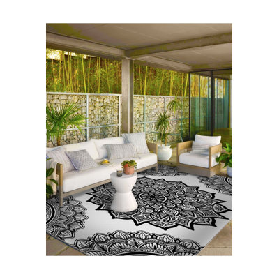 Tapis noir lavable à motif d'étoile tissé