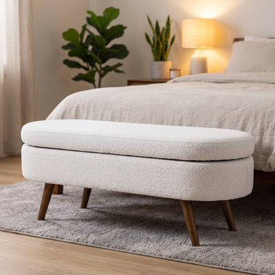 Banc de rangement avec repose-pieds ovale avec revêtement en tissu plissé, pieds en bois d'hévéa et compartiment de rangement caché - repose-pieds polyvalent, sièges supplémentaires et décoration de salon