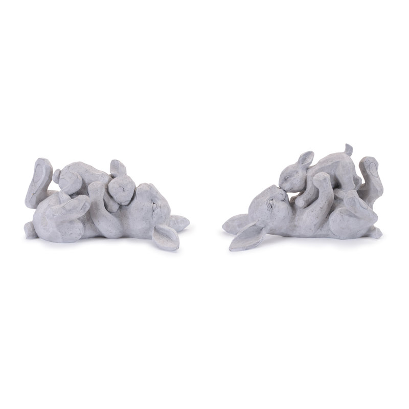 Figurine de lapin couché avec un lapin