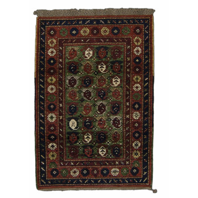 Seychour Wool Oriental Area Rug in Green/Red