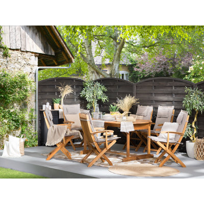 Deidra 8 - Person Acacia Solid Wood Patio Dining Set Extendable and Umbrella Hole Included Oval Table with Cushions Included