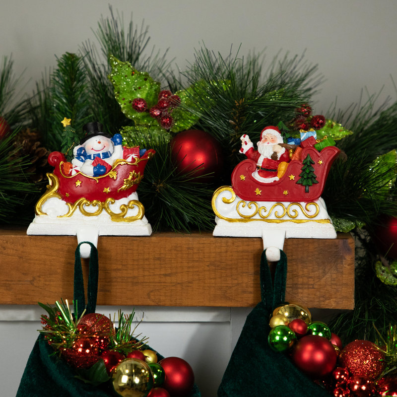 Santa and Snowman Sleigh Ride Resin Stocking Holders Set