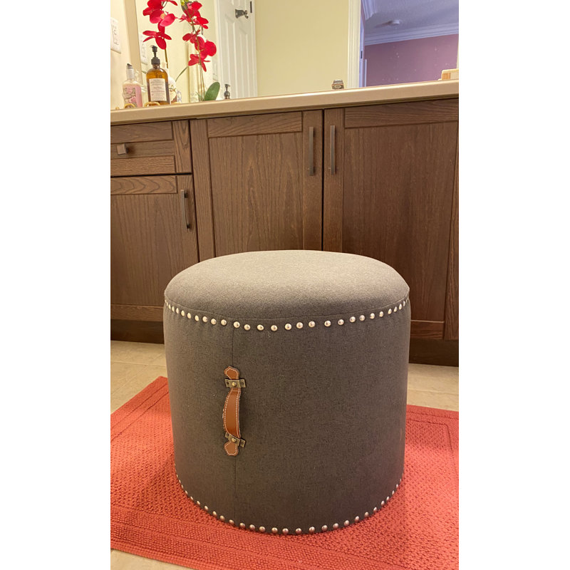 Johnny Fabric Upholstered Round Pouf Ottoman with Faux Leather Handle, Black Polyester
