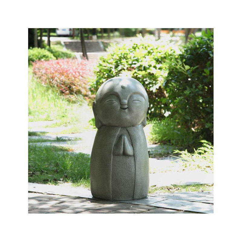 Statue de Jizo japonais chanceux qui prie