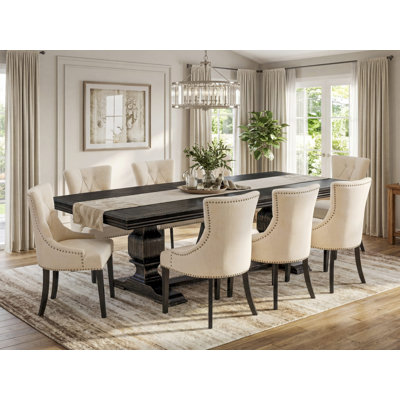9-piece dining set consists of a dining table & 8 Light Beige Linen Fabric kitchen chairs & black legs with Button Tufted Back - Sand Blasting Black finish.