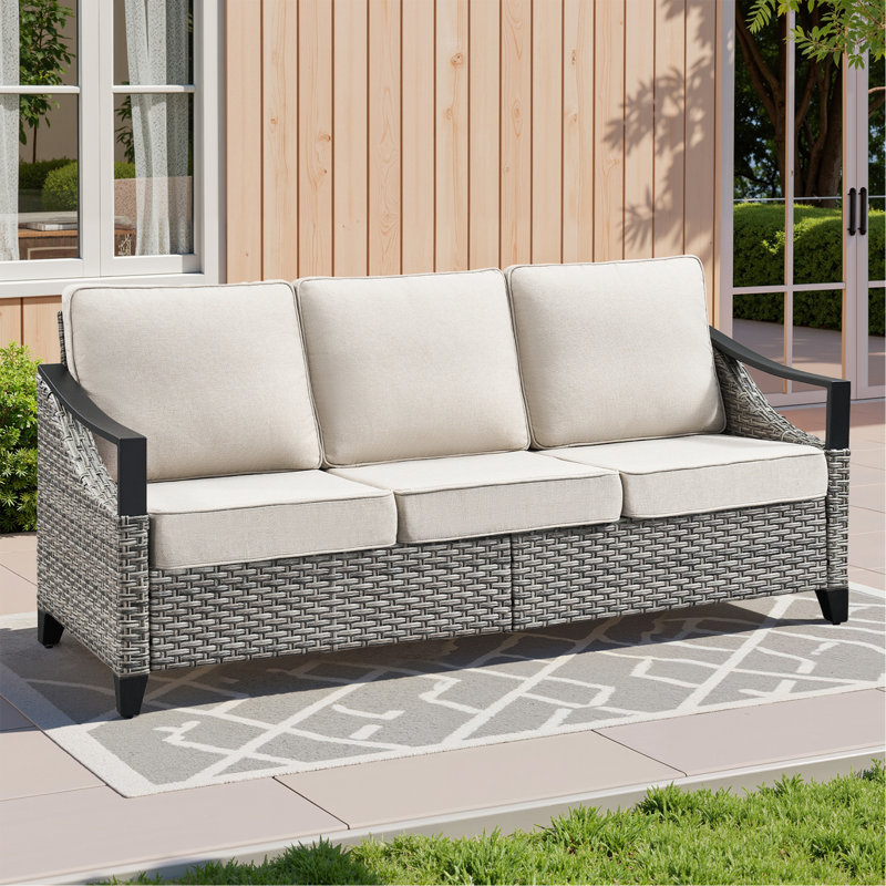 Canapé d'extérieur en résine tressée de 186 cm de large, avec coussins beiges, idéal pour terrasse, porche et jardin.