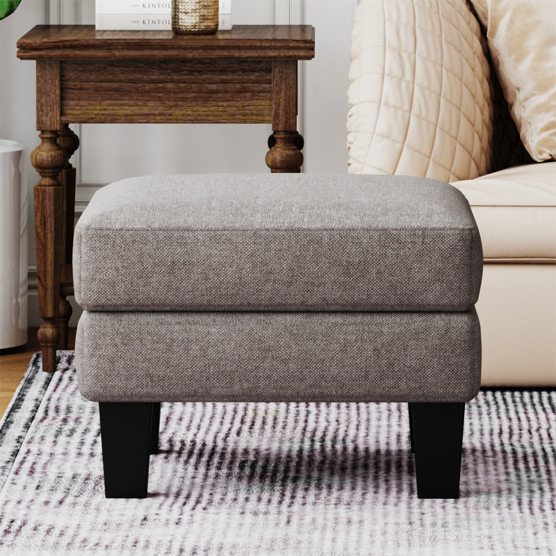 Repose-pieds en tissu gris clair