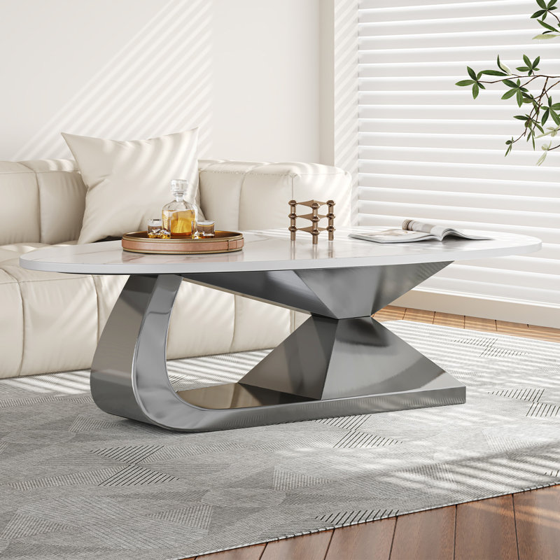Table basse moderne en pierre frittée avec base en acier inoxydable
