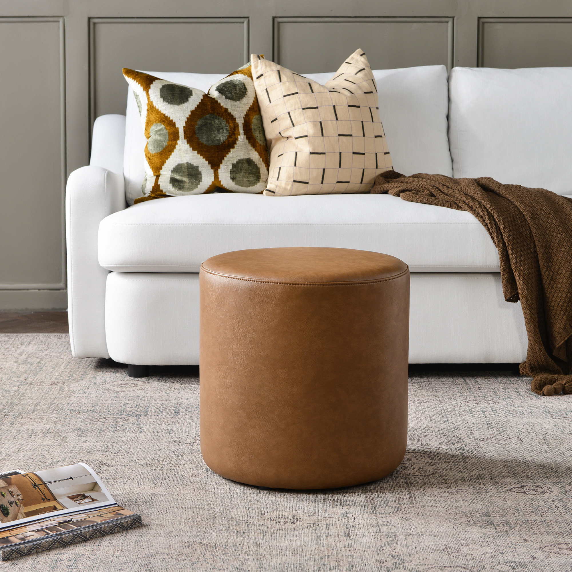 Ebern Designs 18" Wide Faux Leather Round Upholstered Ottoman | Wayfair