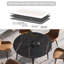 Table de salle à manger ronde avec base noire en métal et égratignure