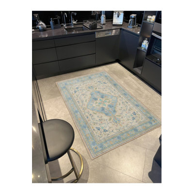 Tapis bleu tissé à motif géométrique lavable à la machine