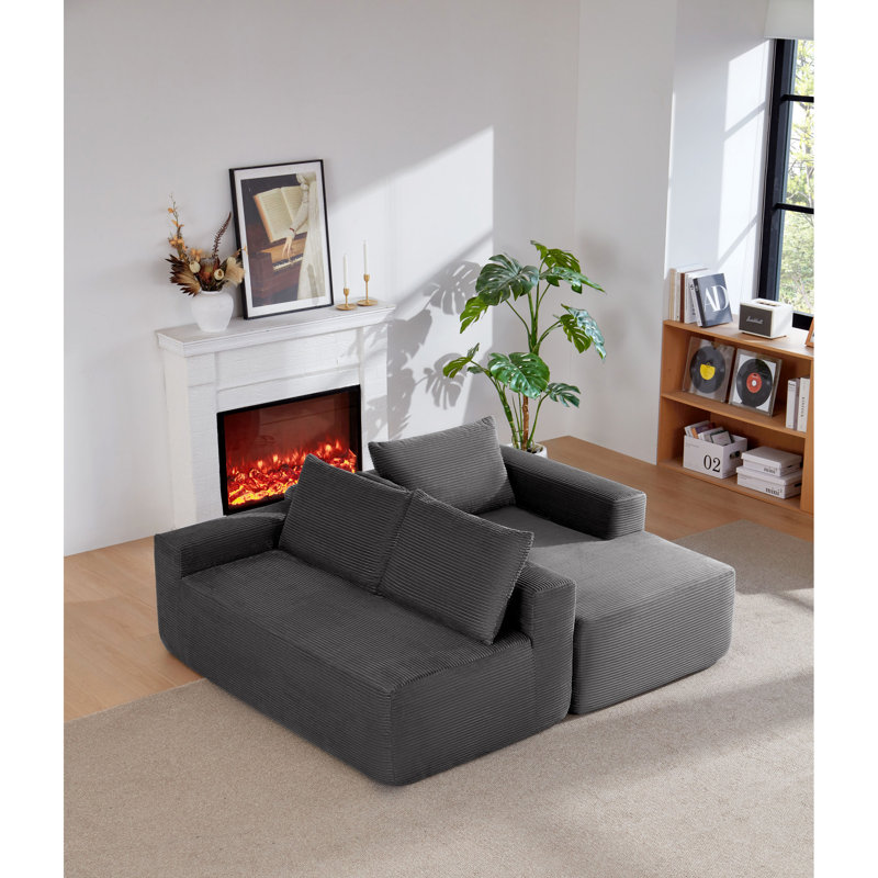 Canapé modulaire spacieux avec assise profonde, velours côtelé gris, salon