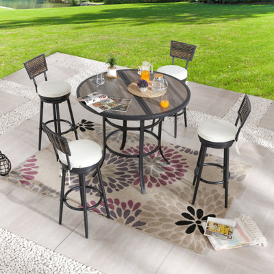 Gunselman 4 - Person Wicker Patio Dining Set with Round Table