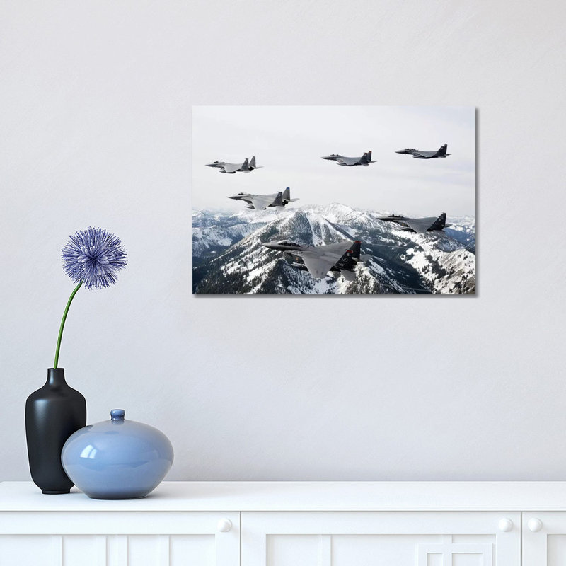 A Six-Ship Formation Of Aircraft Fly Over The Sawtooth Mountains In Idaho by Stocktrek Images - Wrapped Canvas Print
