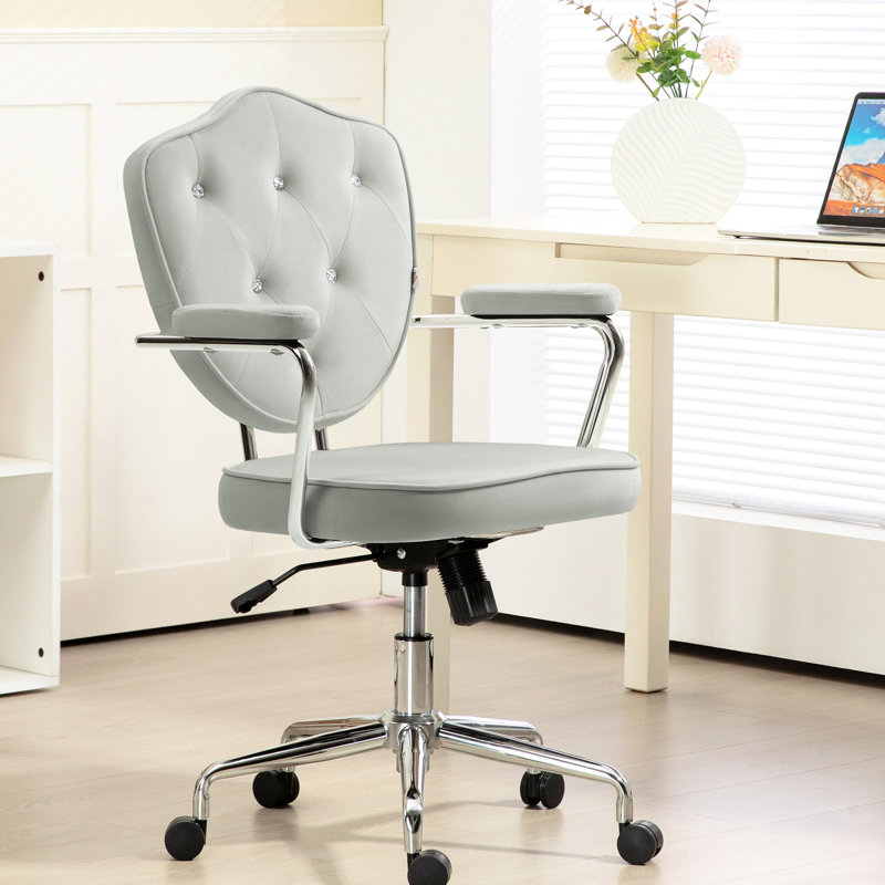 Fauteuil de bureau gris avec siège en velours et inclinaison réglable