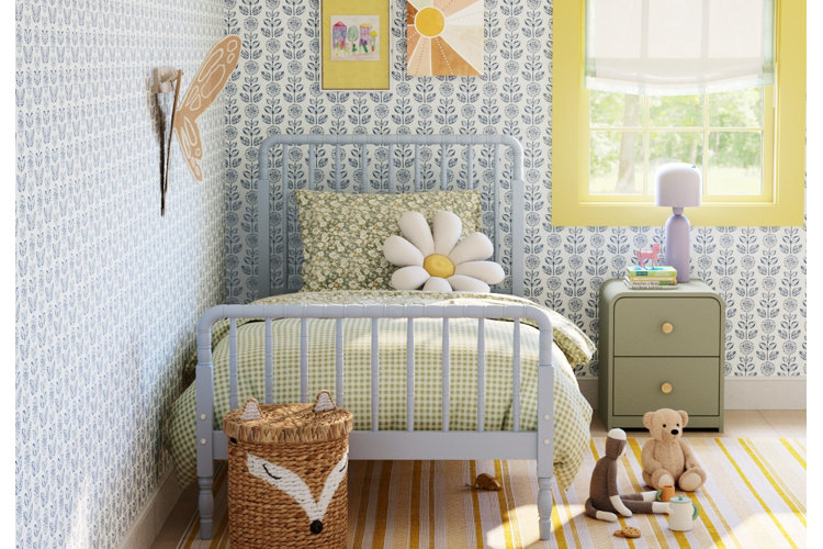 cottage core style girl bedroom with purple floral wallpaper and wood framed bed and fox themed laundry basket