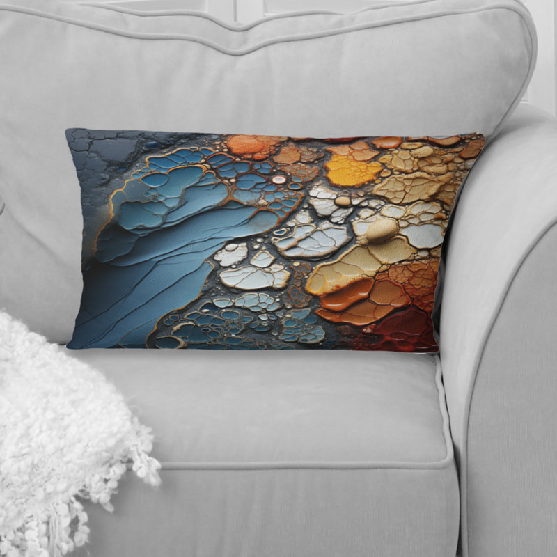 Coussin décoratif bleu et orange à motif de formes abstraites
