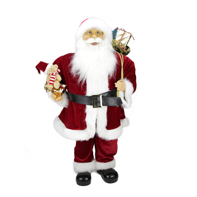 Figurine de père Noël avec sac-cadeau