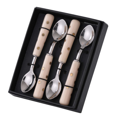 Ensemble de quatre élégantes cuillères à café en acier inoxydable avec finition polie, parfaites pour un usage quotidien et pour recevoir.