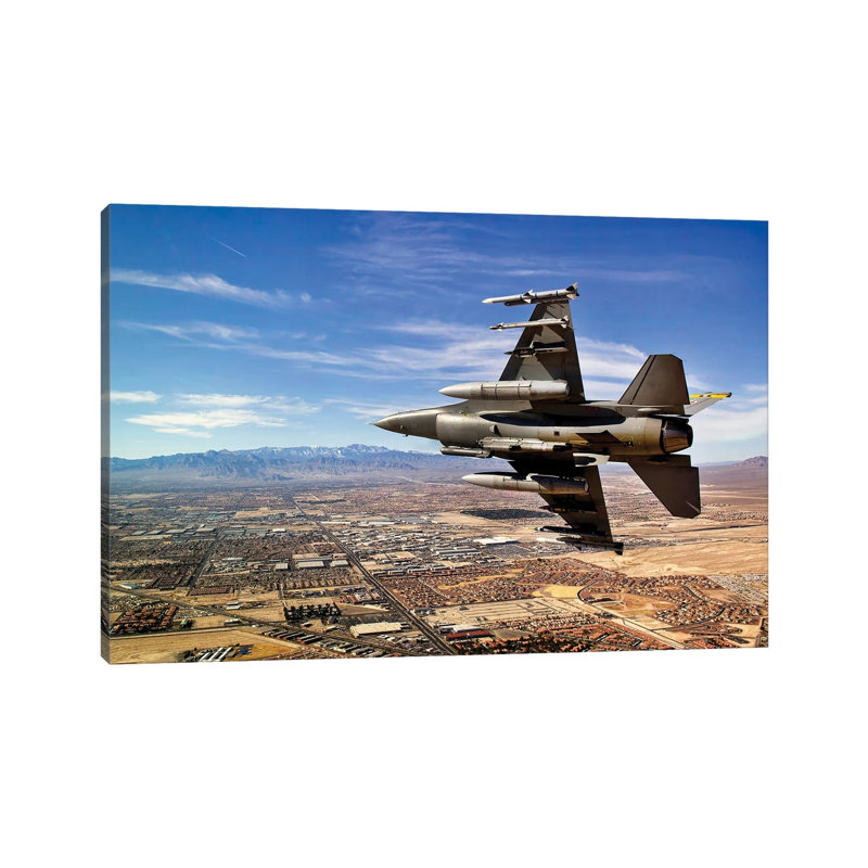 A Fighter Jet Breaks Right On A Final Approach Over Northern Las Vegas, Nevada by Stocktrek Images - Wrapped Canvas Print