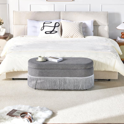 Repose-pieds ovale rembourré avec rangement à franges et couvercle relevable - L 39 po x l 16 po x H 17 po, repose-pieds multifonctionnel et rangement caché pour le salon ou la chambre à coucher - Tissu gris avec structure en métal
