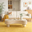 Table basse irrégulière avec plateau rabattable et compartiment de rangement caché