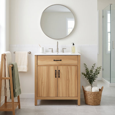 Meuble-lavabo standard autoportant de 76 cm (30 po) en bois massif et MDF, avec lavabo en céramique, tiroir à charnières, tiroirs à fermeture amortie et étagères à deux niveaux. Robinetterie non incluse.