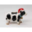 Vache portant un ornement de Noël suspendu à un chapeau de Noël