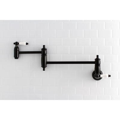 Kingston Brass Restoration Two-Handle 1-Hole Wall Mount Pot Filler Faucet