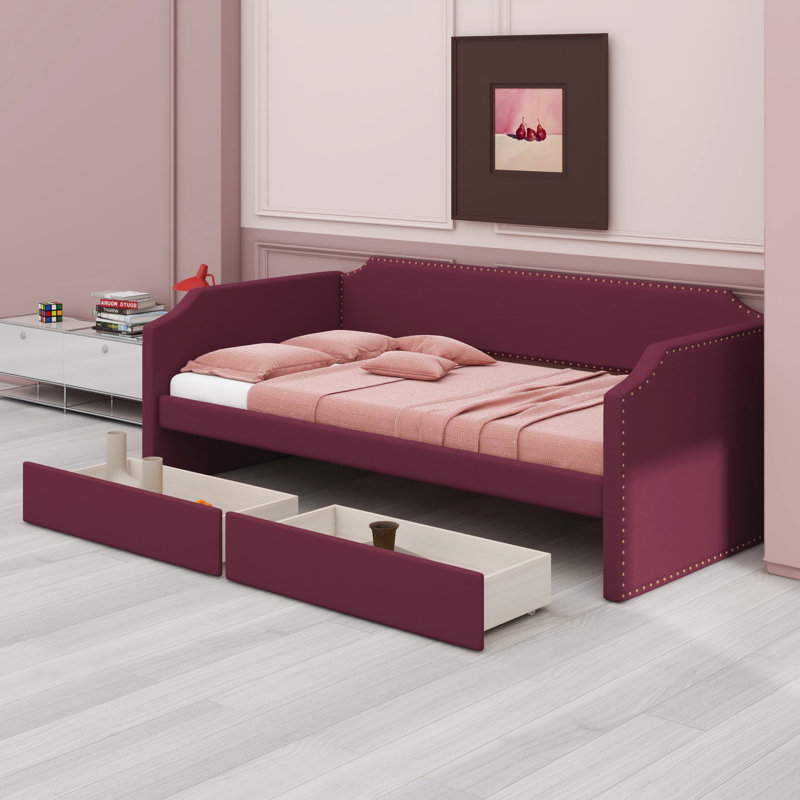 Lit de jour contemporain mettant en valeur une finition rembourrée moelleuse et des tiroirs de rangement pratiques pour un confort ultime