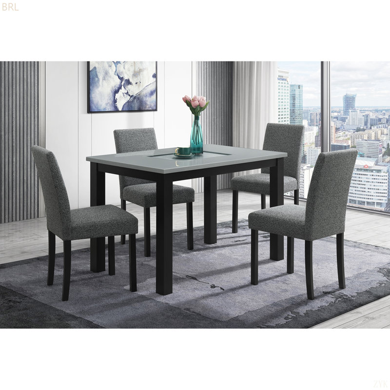 Table de salle à manger grise et noire avec ensemble de chaises