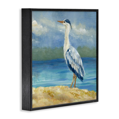 Héron sur une plage nuageuse, art de la giclée encadrée par Lanie Loreth
