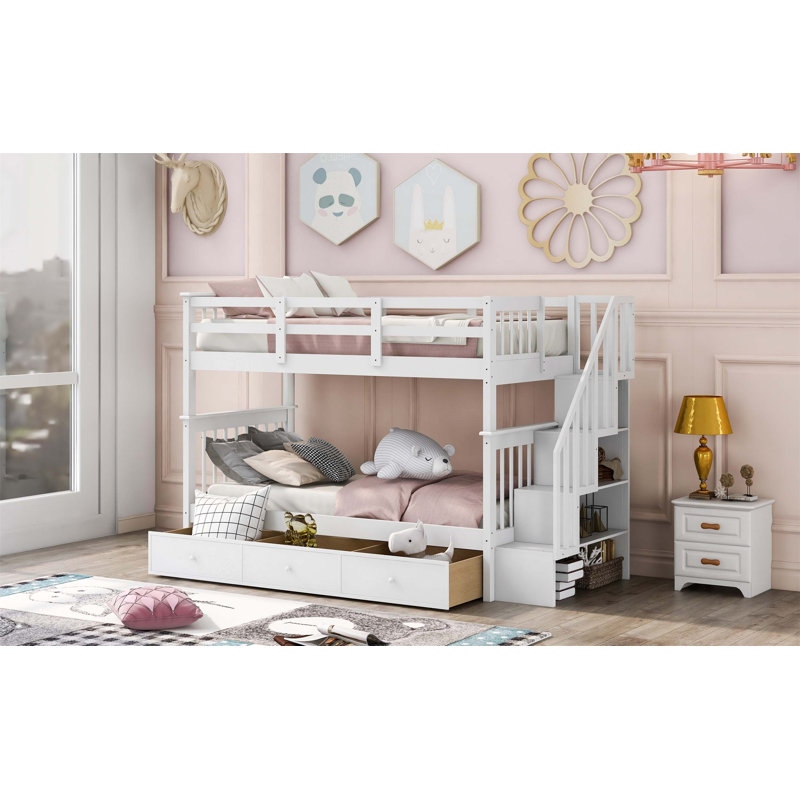 Lit superposé simple au-dessus de simple avec tiroirs de rangement intégrés et escalier pour une chambre à coucher ou un dortoir efficace.