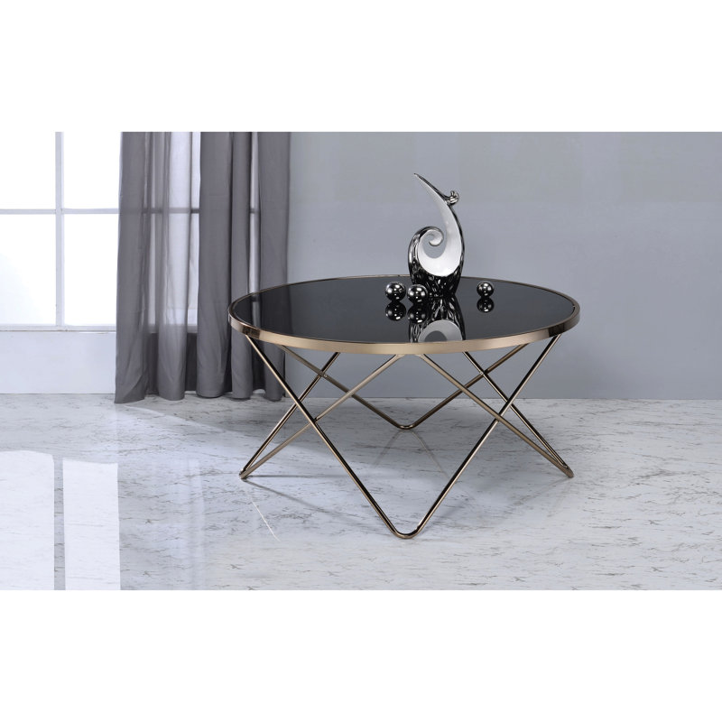 Table basse contemporaine en verre noir avec pieds champagne élégants