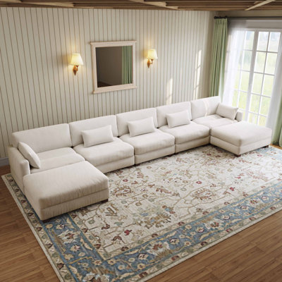 Canapé modulaire rembourré en velours côtelé beige de 7 pièces Maelina avec dossier coussiné et repose-pieds amovible