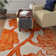 Coleman Hand Tufted Wool/Cotton Floral Rug in Ivory/Orange