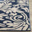 Tapis bleu marine / ivoire à motif floral Ammundsen-1688096086