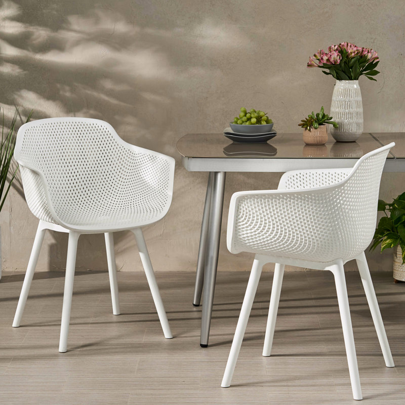 Fauteuil Lotus blanc en polypropylène blanc - Structure stable, résistante aux intempéries, motif en losanges perforé pour les meubles de salle à manger élégants