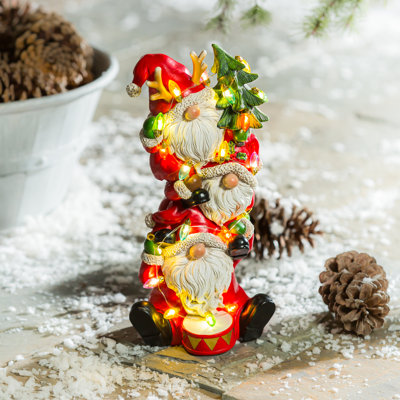 Statuaire de père Noël empilé