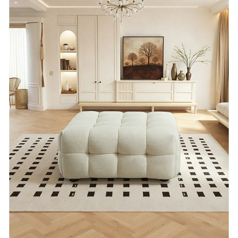 Repose-pieds moderne et bouclé crème pour le salon
